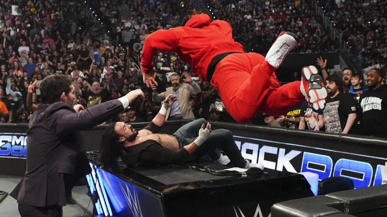 Jacob Fatu splashes Drew McIntyre through the announce table on "WWE SmackDown"