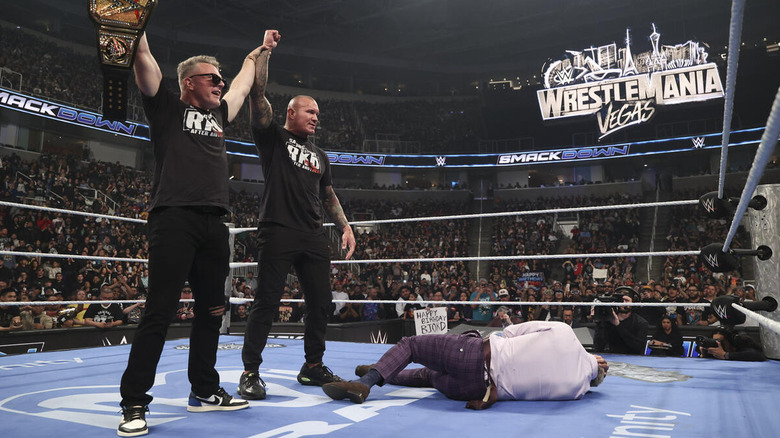 Pat McAfee and Randy Orton stand over Cody Rhodes on "WWE SmackDown"