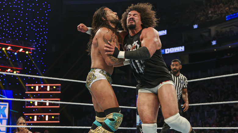Carlito and Santos Escobar wrestle