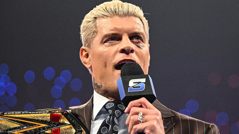 Cody Rhodes speaks into a microphone on "WWE SmackDown"
