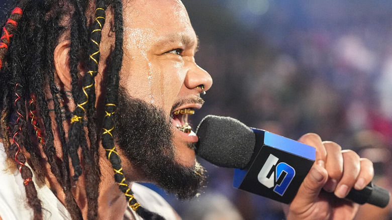 Jacob Fatu with a microphone on "WWE SmackDown"