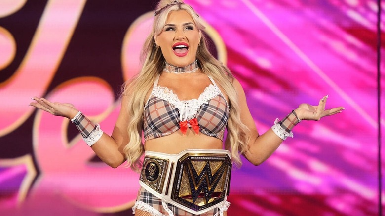 Tiffany Stratton posing with her title belt