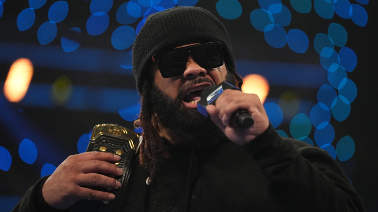 Jacob Fatu cuts a promo in a beanie and sunglasses