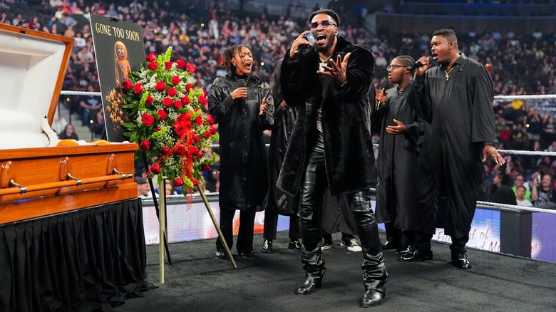 Trick Williams sings with a choir at the gingerbread man's funeral on "WWE SmackDown"