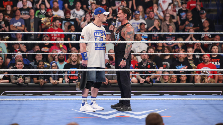 Cena and Punk staring each other down