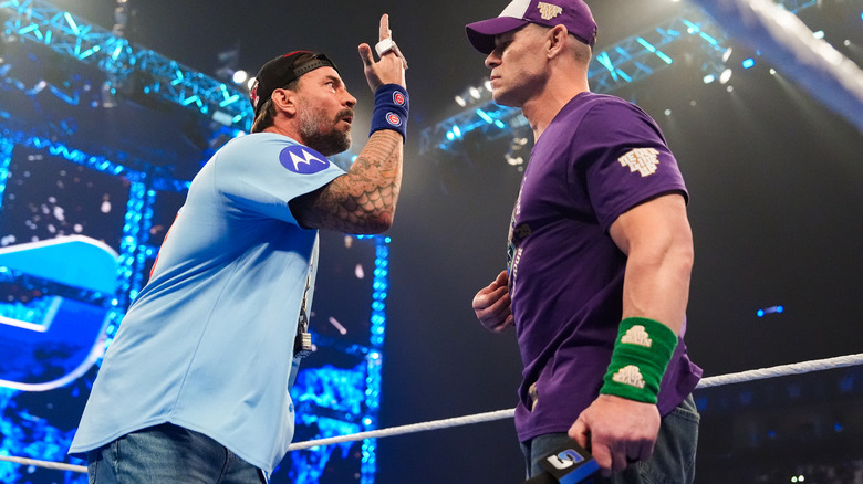 "Doctor of Punkanomics" CM Punk gestures in front of John Cena on "WWE SmackDown"