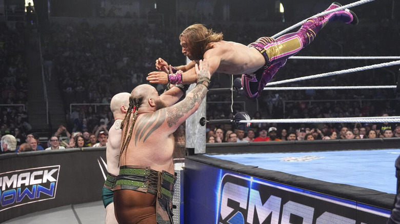 Nathan Frazer dives from the ring onto the War Raiders on the outside on "WWE SmackDown"