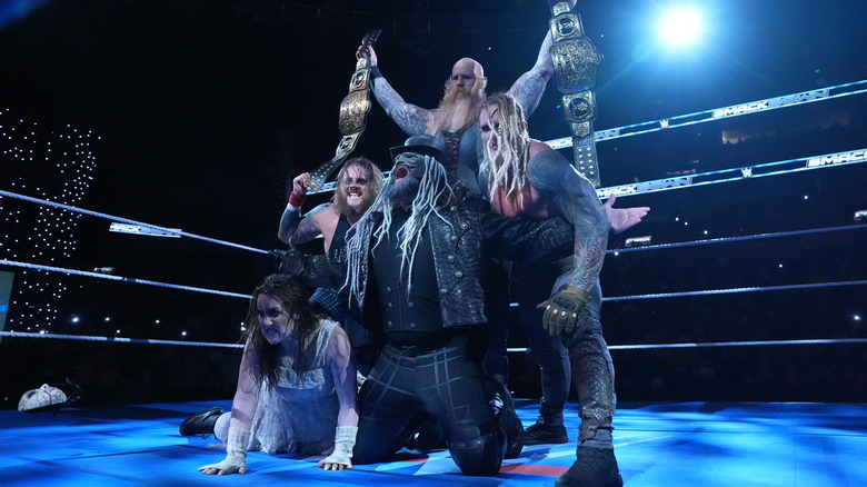 Uncle Howdy, Nikki Cross, Erick Rowan, Joe Gacy, Dexter Lumis of the Wyatt Sicks pose for an in-ring portrait during SmackDown at Bridgestone Arena on July 11, 2025 in Nashville, Tennessee.