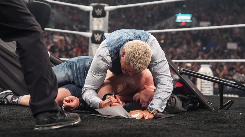 Cody Rhodes forces John Cena to sign a contract