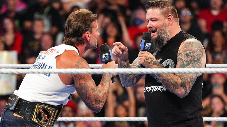 CM Punk and Kevin Owens in a promo battle