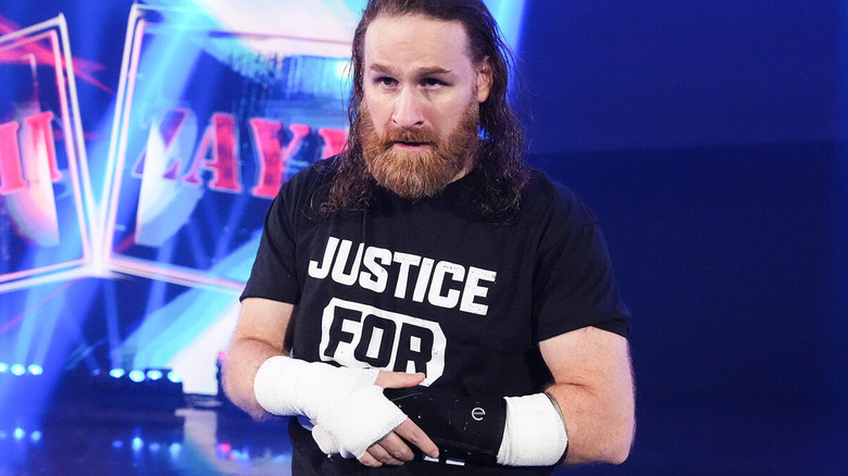 Sami Zayn cradles his broken hand on "WWE SmackDown"