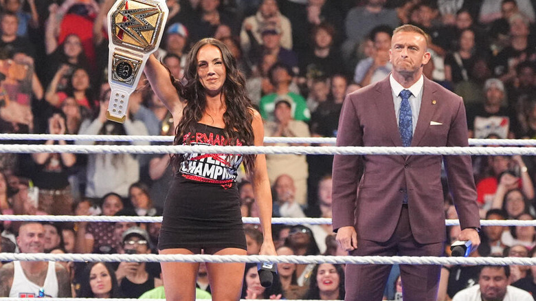 Chelsea Green holds on the women's title while Nick Aldis watches on "WWE SmackDown"