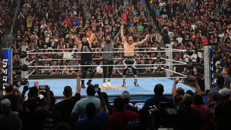 Jimmy Uso, Sami Zayn, and Jacob Fatu in the ring on "WWE SmackDown"