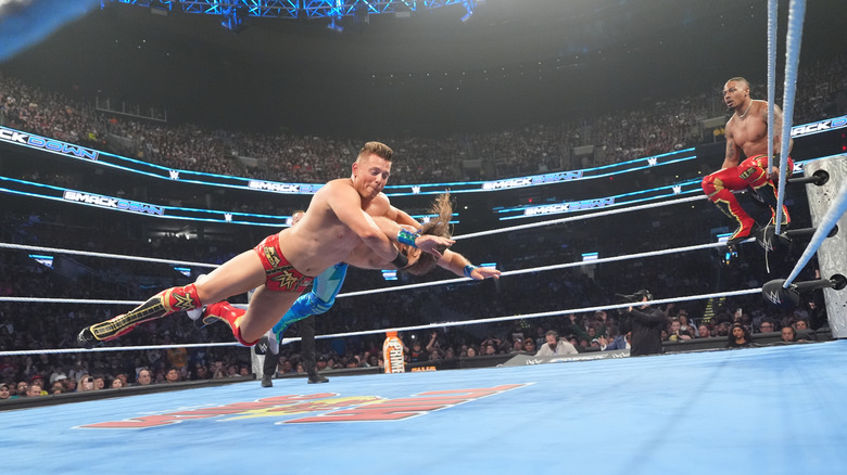 Carmelo Hayes watches as The Miz delivers his finisher to Nathan Frazer on "WWE SmackDown"