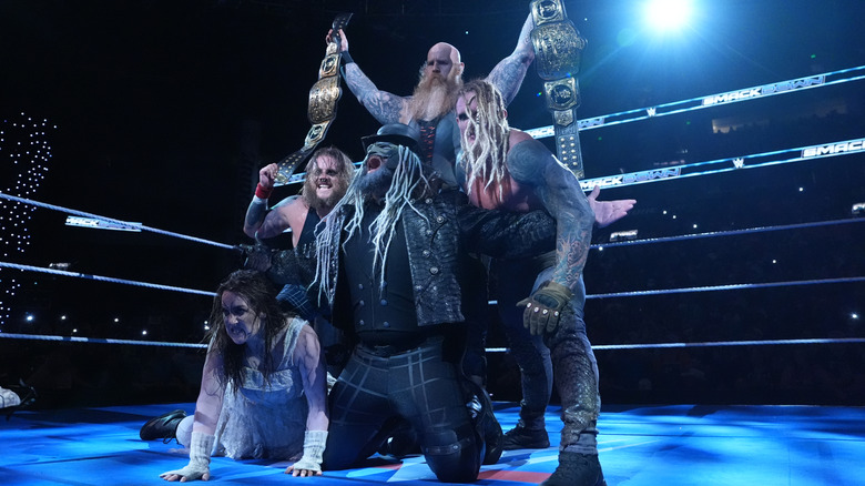 Uncle Howdy, Nikki Cross, Erick Rowan, Joe Gacy, Dexter Lumis of the Wyatt Sicks pose for an in-ring portrait during SmackDown at Bridgestone Arena on July 11, 2025 in Nashville, Tennessee.