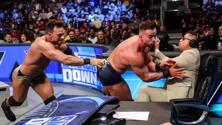 LA Knight throws Austin Theory into The Miz