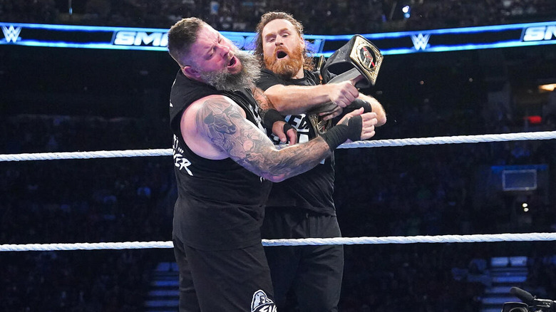 Sami Zayn hits Kevin Owens with the WWE title belt on "SmackDown"