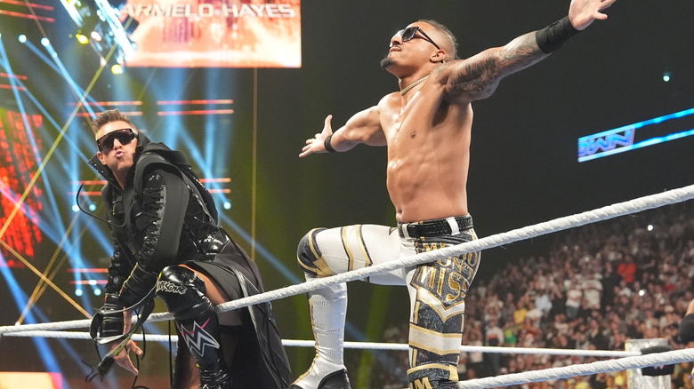 The Miz leans on the top ropes alongside Carmelo Hayes.