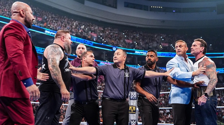 Referees and officials try to separate Kevin Owens and CM Punk on "WWE SmackDown"