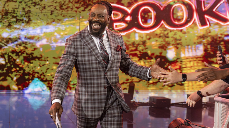 Booker T making his way to the commentary table