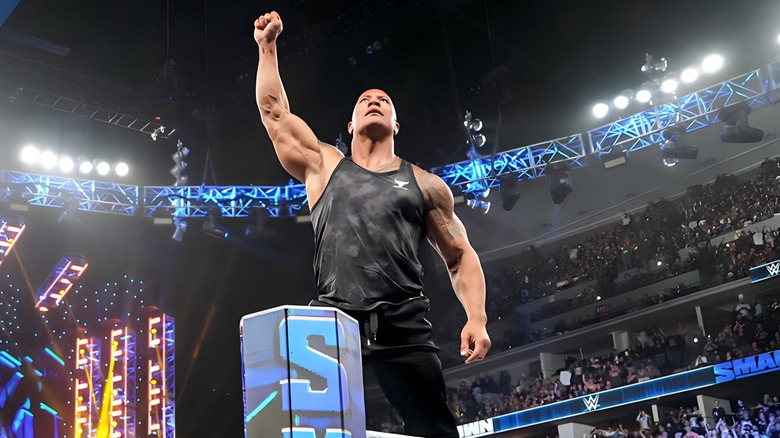 The Rock with arm raised