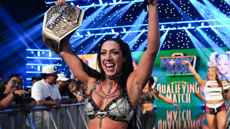 Jacy Jayne celebrates outside the ring with her United States title on "WWE SmackDown"