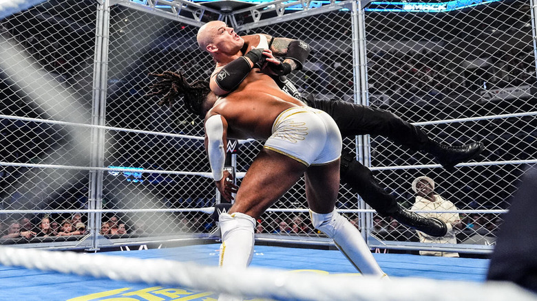 Trick Williams hits a Book End on Baron Corbin inside a steel cage as Lil Yachty looks on on "WWE SmackDown"