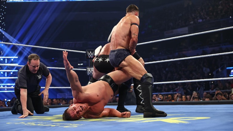 CM Punk and Finn Balor with a double Boston Crab on GUNTHER in the ring on 