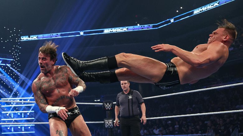 GUNTHER dropkicks CM Punk in the ring on "WWE SmackDown"