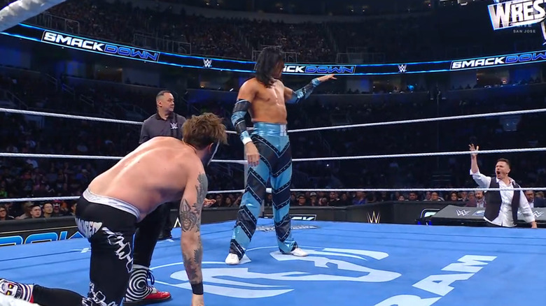 Danhausen and Wilson in the ring as Wilson talks to The Miz on the outside