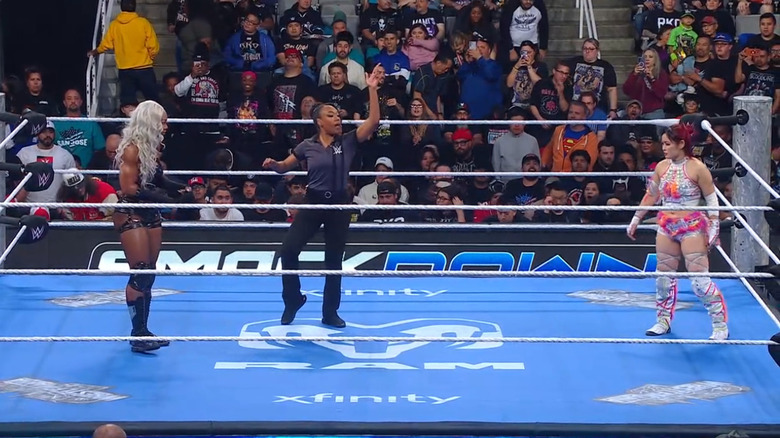 Cargill and SKY staring down one another in the ring