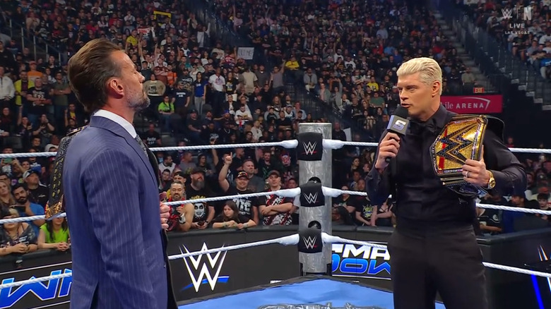 Rhodes and Punk talking the ring