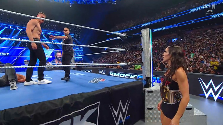 Green staring down GUNTHER from outside the ring