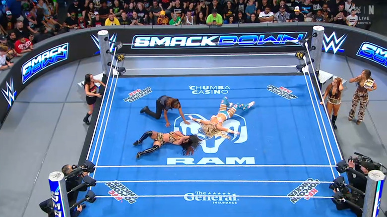 Jayne and Stratton both down in the ring as Green, Reid, and Henley are on the outside