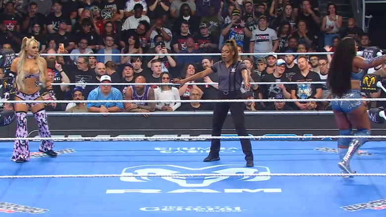 Stratton and Legend staring down one another inside the ring