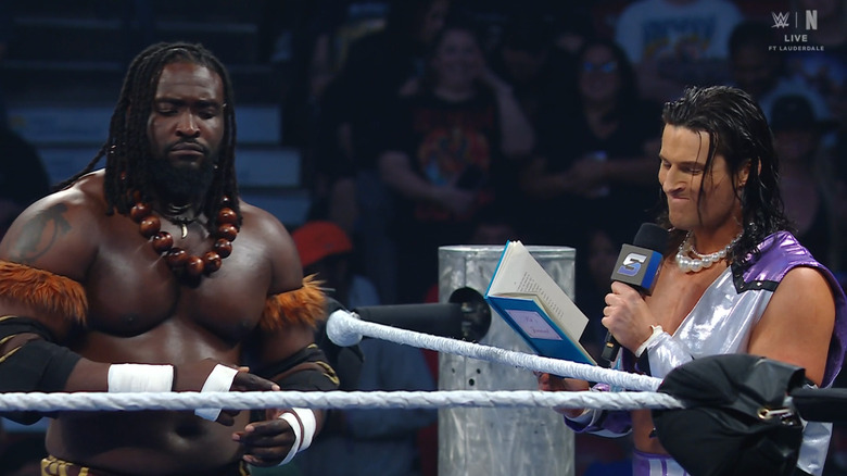 Wilson reading his poem to Femi