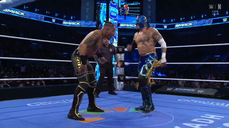 Hayes and Fenix brawling in the ring