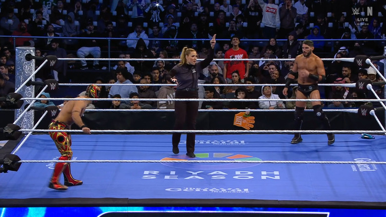 Axiom and Gargano staring one another down in the ring