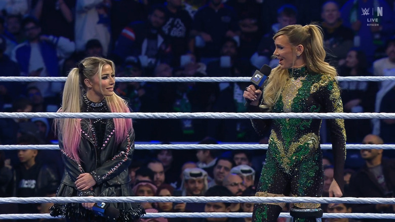 Bliss and Flair speaking in the ring