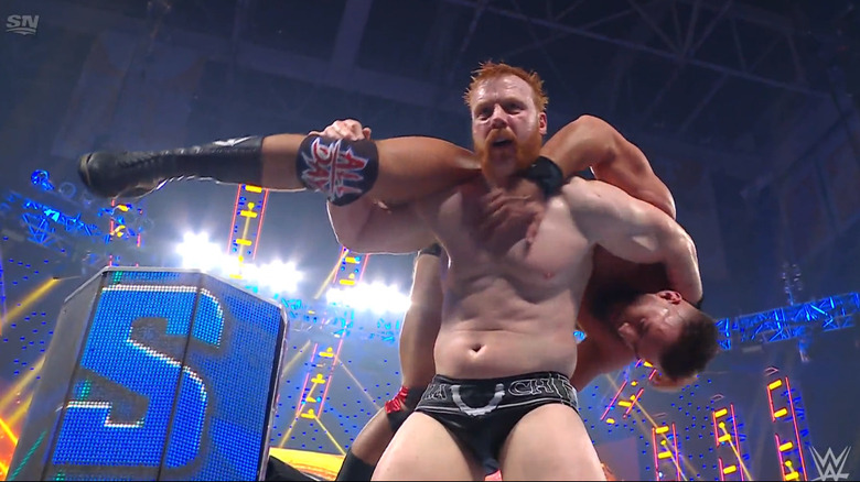 Sheamus with Theory on his shoulders