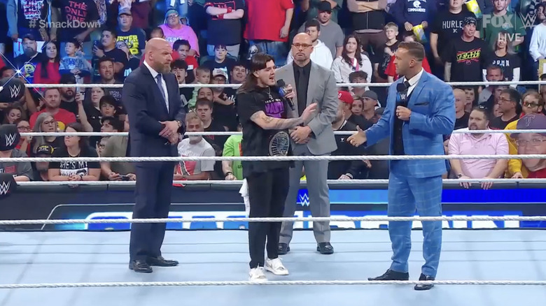 Triple H, Aldis, Pearce, and Dominik in the ring