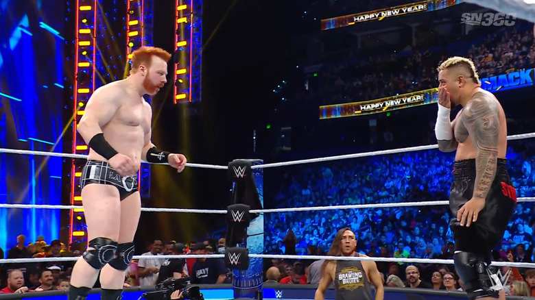 The pair staring one another down in the ring