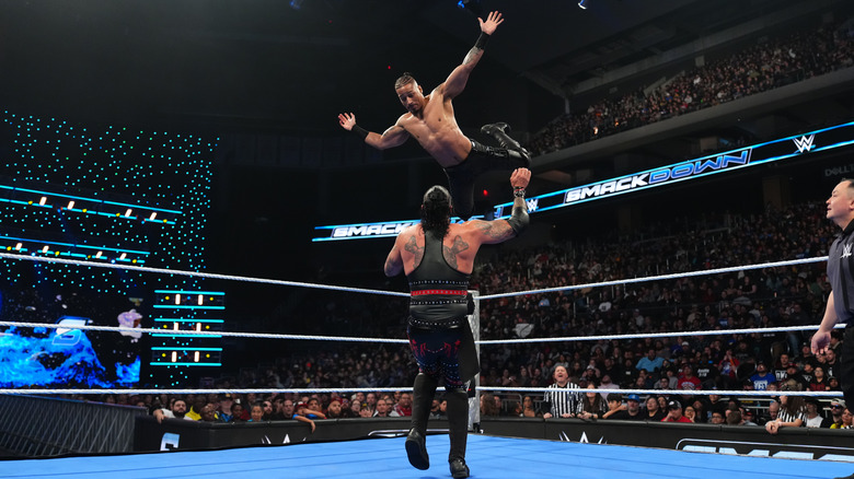 Carmelo Hayes diving on Damien Priest