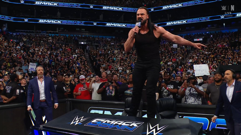 McIntyre standing on top of the announce desk