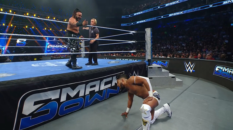 Fatu calling for Williams to get back inside the ring