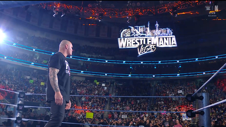 Orton staring at the WrestleMania 42 sign