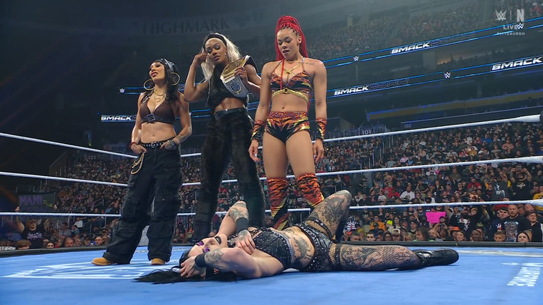 Michin, Cargill, and B-Fab standing over Ripley