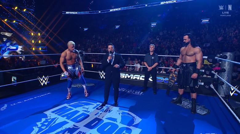 Rhodes and McIntyre staring one another down during the ring announcement