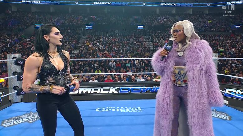 Ripley and Cargill talking to one another in the ring