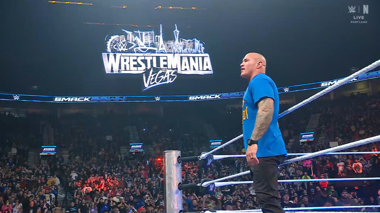 Orton standing on the ring apron with the WrestleMania 42 sign in the background